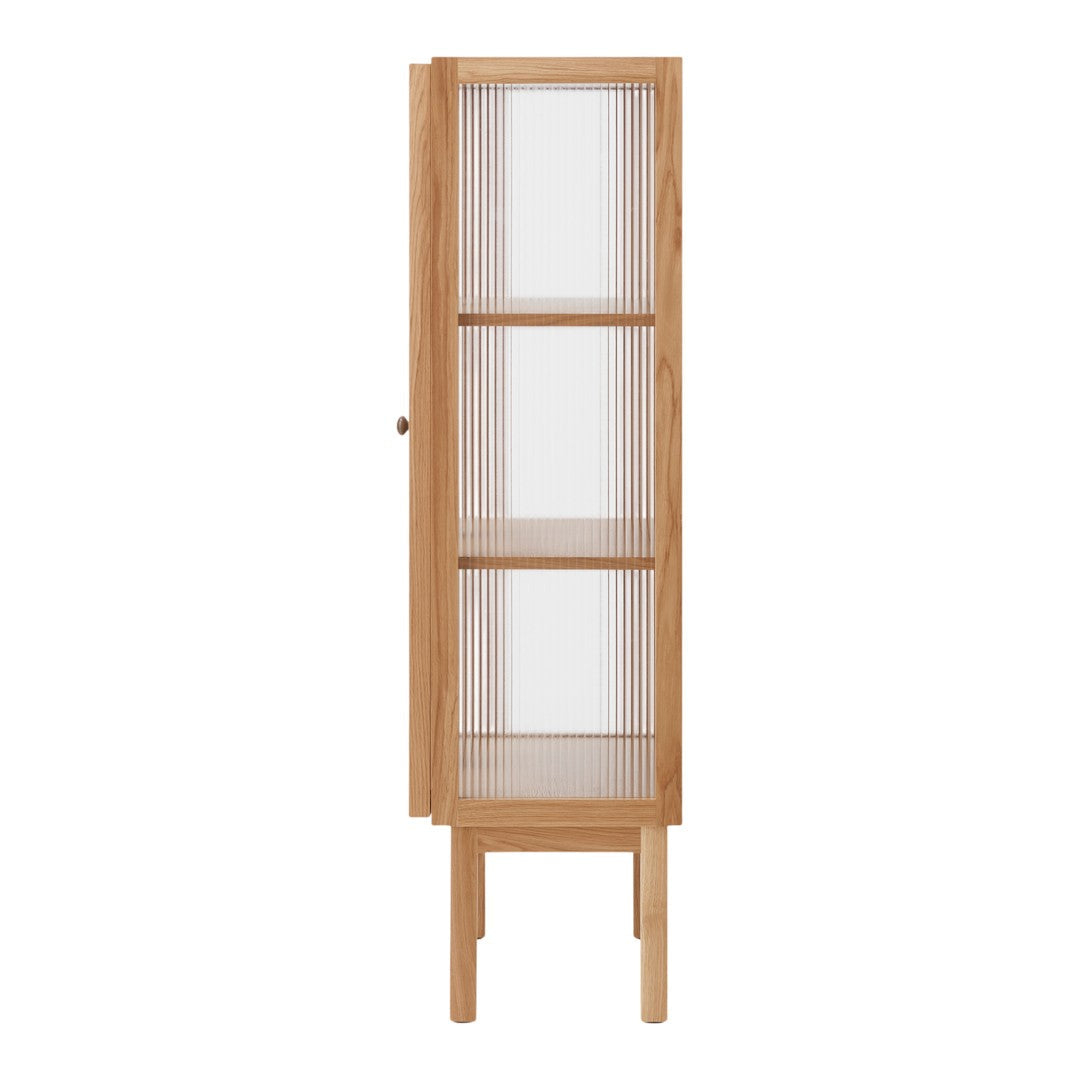 Tall wooden cabinet in natural oak finish with clear glass panels and simple, vertical line pattern on doors.