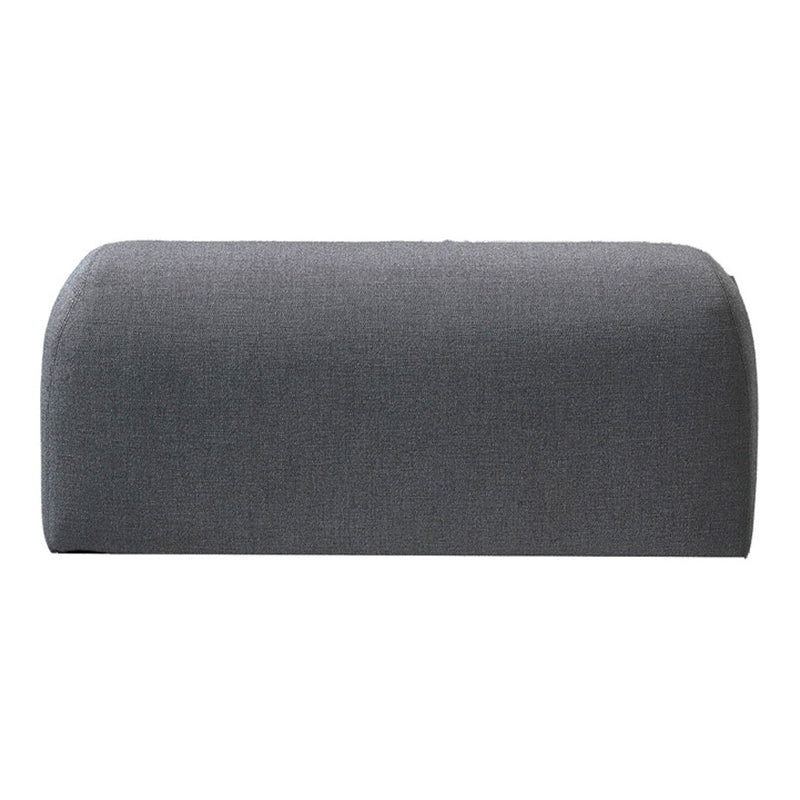 Gray upholstered bench with a smooth, curved design and subtle texture. Ideal for modern decor.
