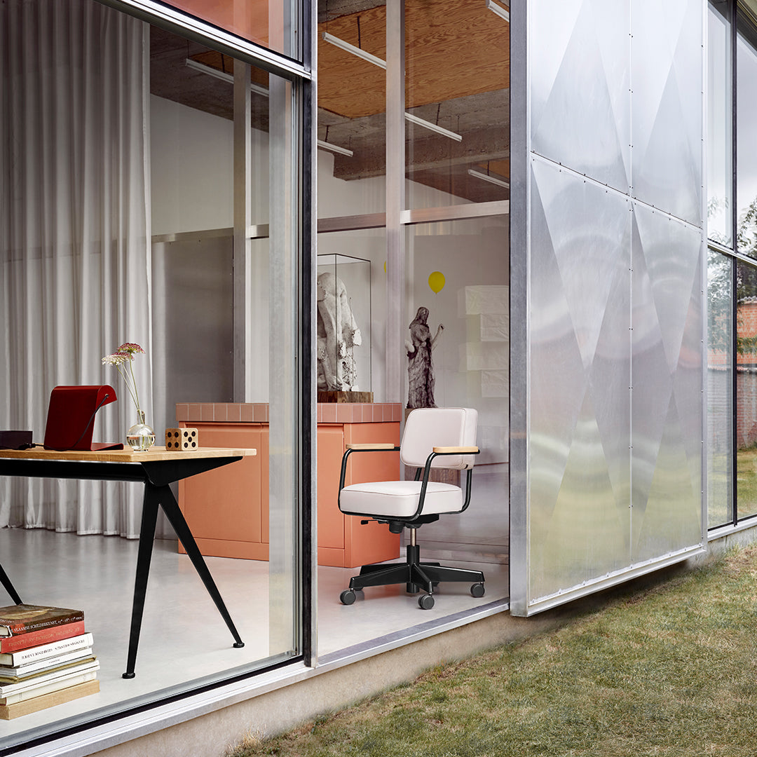 Modern office chair in white fabric with a sleek, minimalist design, set against neutral tones and soft pastels.