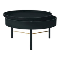 Round black coffee table with a sleek design and a contrasting gold metal support bar. Modern minimalistic style.