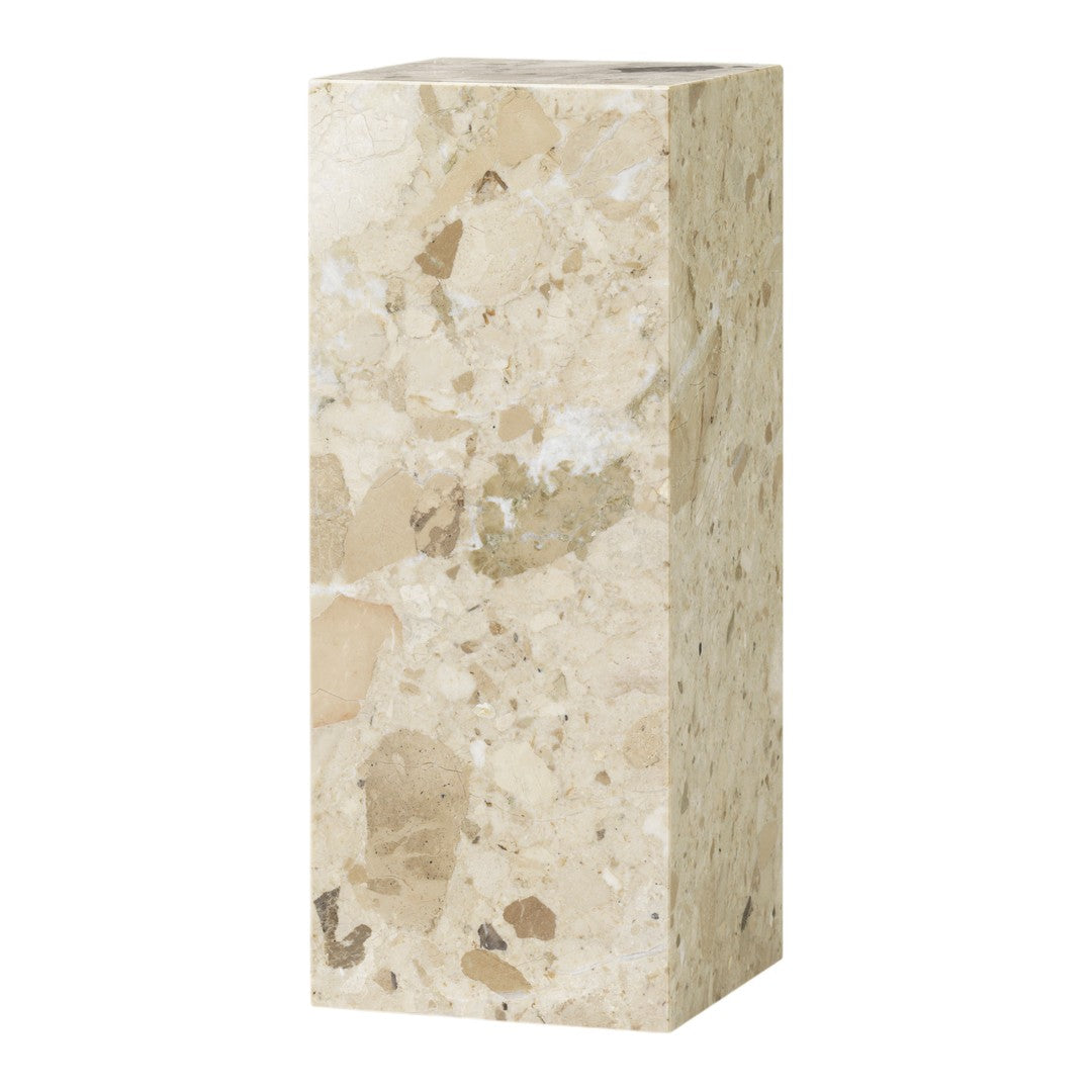 Light beige marble pedestal with varying speckles and patterns for a natural stone finish.