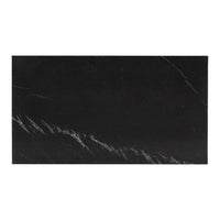 Black marble slab with striking white veining, perfect for modern decor and elegant surfaces.