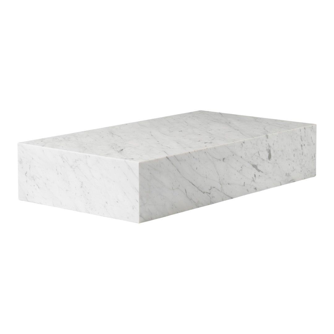 White marble block with subtle gray veining and a smooth, polished finish.