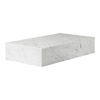 White marble block with subtle gray veining and a smooth, polished finish.