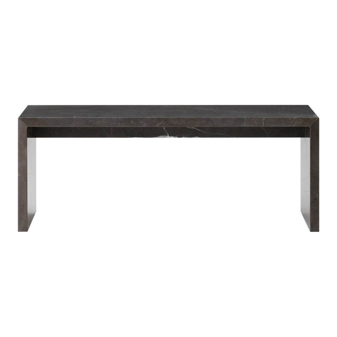 Modern dark marble dining table with subtle veining, showcasing a sleek, minimalistic design. Perfect for contemporary spaces.