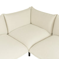 Cream-colored corner sofa with textured upholstery and smooth, minimalist design.