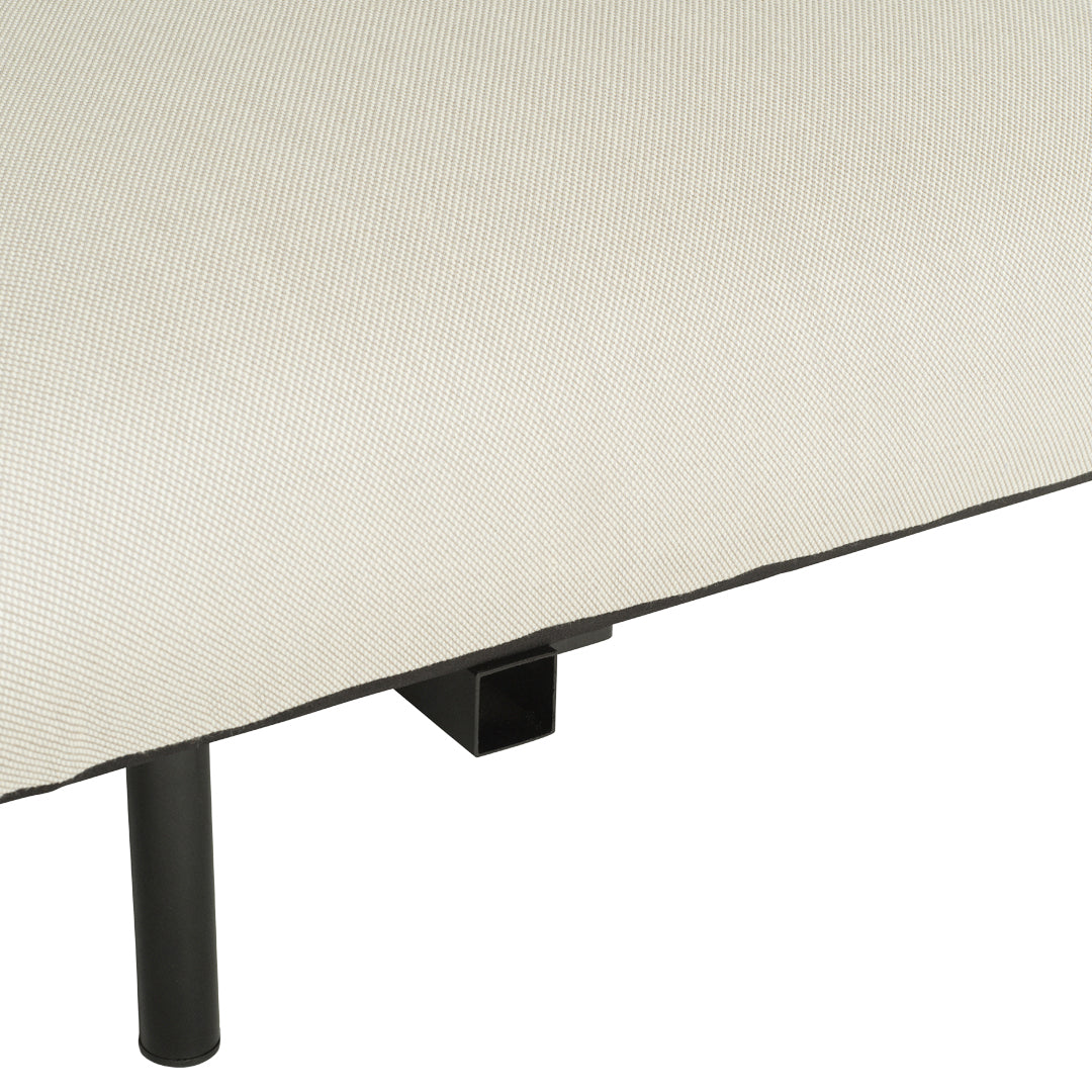 Beige fabric cushion with a subtle texture, featuring a sleek black metal frame for a modern touch.
