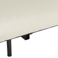 Beige fabric cushion with a subtle texture, featuring a sleek black metal frame for a modern touch.