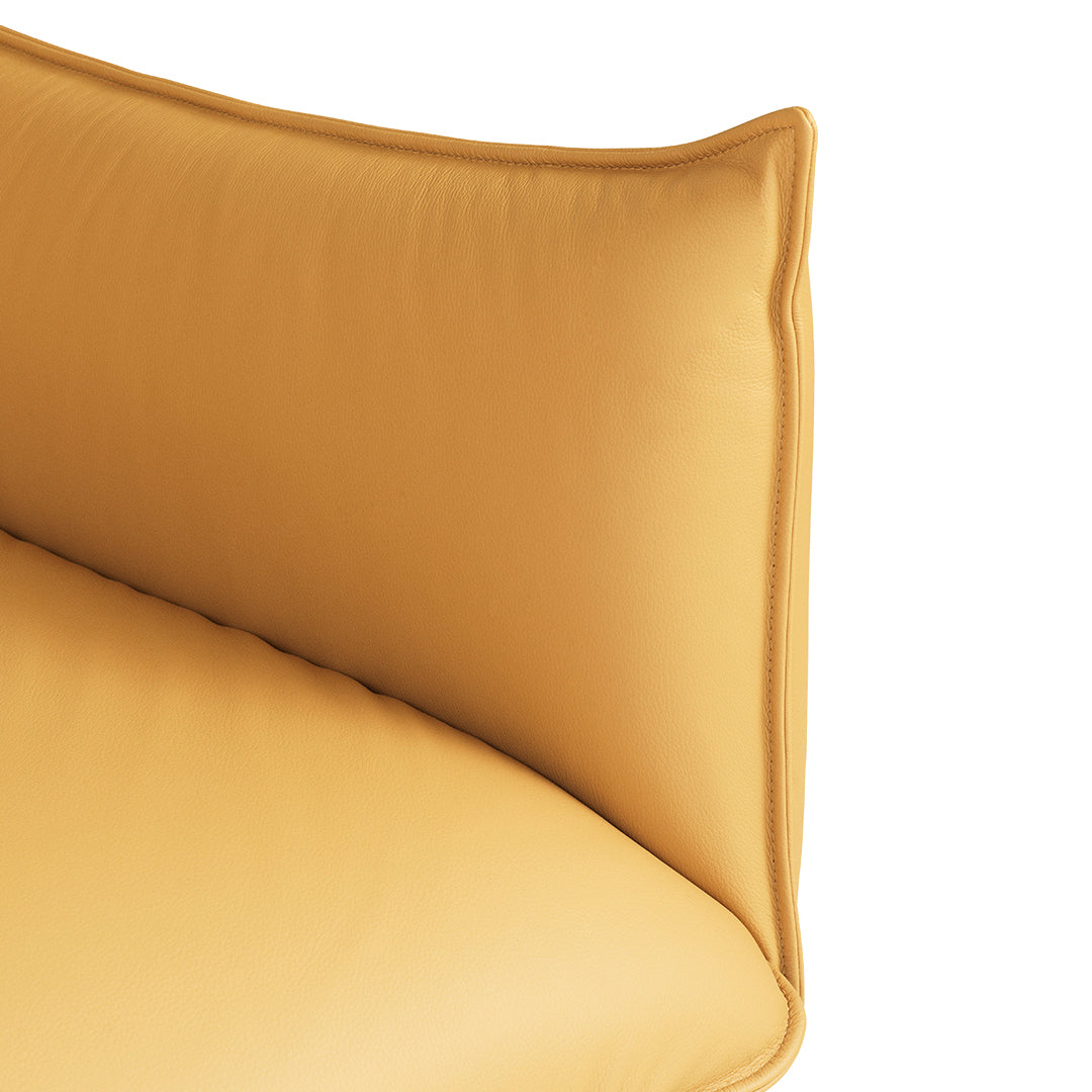 Soft yellow cushion with a smooth texture and rounded edges, perfect for adding a pop of color to any space.