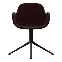 "Deep burgundy chair with sleek black base, featuring a smooth, modern design."
