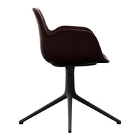 Burgundy upholstered chair with a sleek black base, featuring a smooth, modern design. Perfect for contemporary decor.