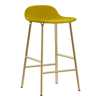 Yellow bar stool with a sleek curved seat and gold metal legs, perfect for modern decor.
