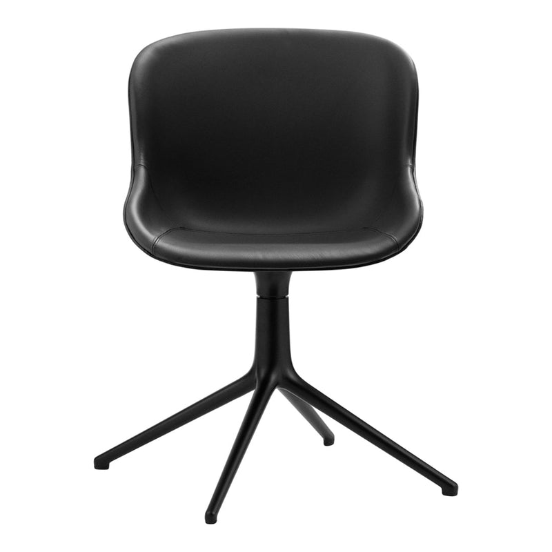 Black molded chair with a smooth finish and minimalist design, featuring a sleek black metal base.