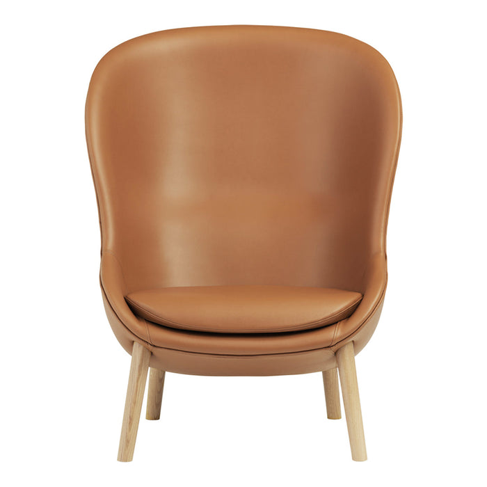 Brown leather accent chair with a smooth finish and minimalist design, featuring natural wooden legs.