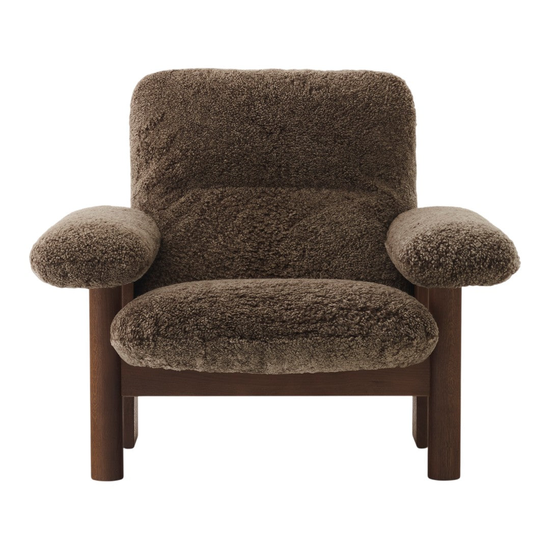 Brown textured upholstery armchair with a cozy, fluffy pattern and wooden frame. Perfect for modern living spaces.