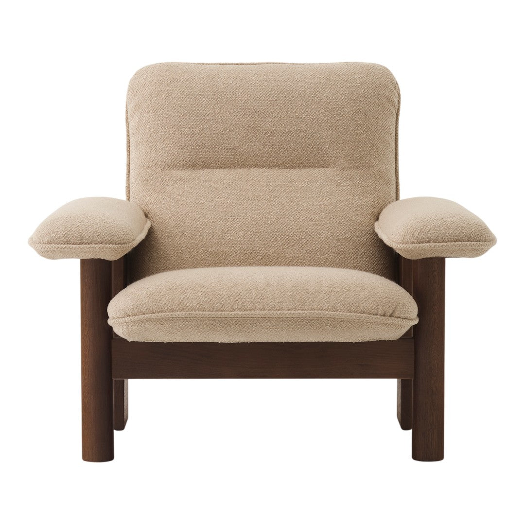 Beige upholstery with a smooth texture and dark wood frame, featuring a minimalist modern design.