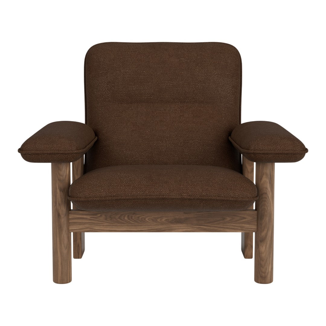 Brown upholstered chair with plush cushioning and simple wooden frame. Ideal for modern and cozy interiors.