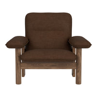 Brown upholstered chair with plush cushioning and simple wooden frame. Ideal for modern and cozy interiors.