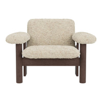 Beige textured upholstery with brown wooden frame, featuring a cozy, modern design and rounded armrests.