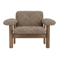 Brown textured armchair with soft, fluffy upholstery and wooden frame, perfect for cozy interiors.