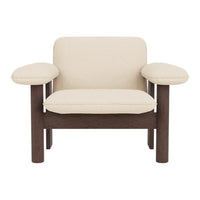 Cream-colored upholstered chair with dark wood accents and a minimalist design. Perfect for modern decor.