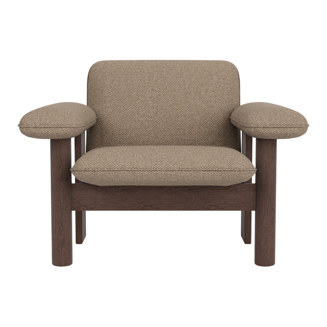Brown textured upholstery on a modern armchair with wooden frame, featuring rounded arms and minimalist design.