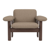 Brown textured upholstery on a modern armchair with wooden frame, featuring rounded arms and minimalist design.