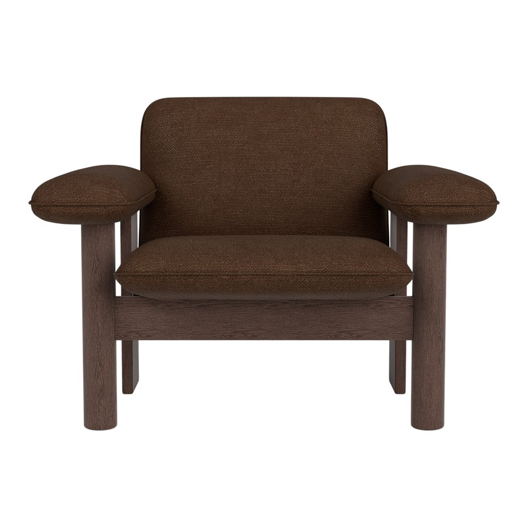 Brown upholstered chair with smooth, rounded arms and a minimalist design. Elegant neutral tones for versatile decor.
