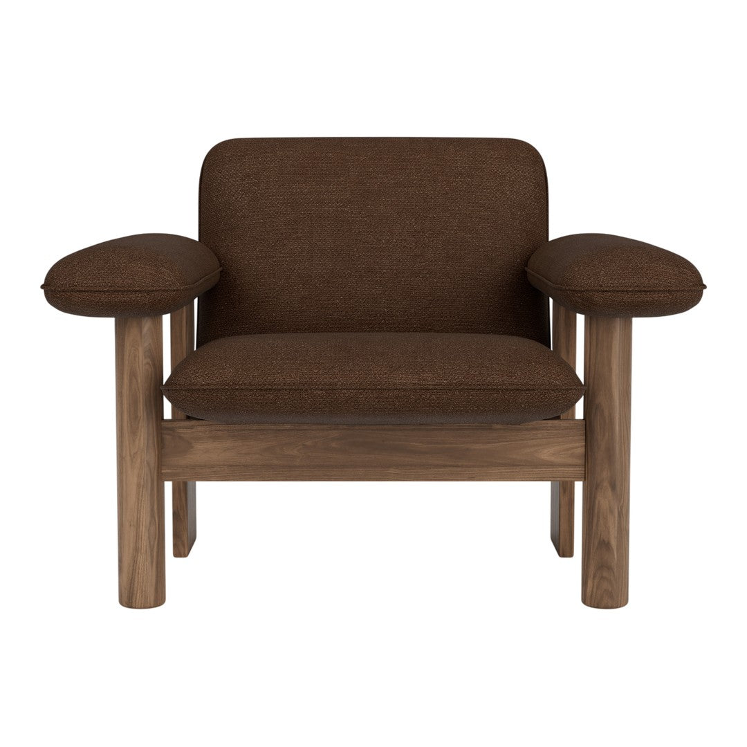 Brown upholstered chair with rounded arms and a wooden frame, featuring a minimalist design.