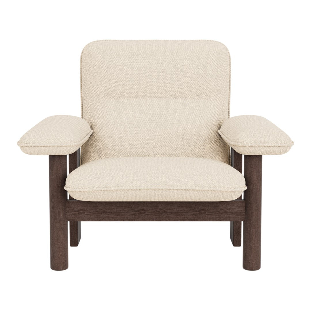 Cream-colored upholstery with a smooth texture, combined with dark wooden legs and arms for a modern look.