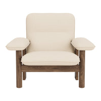 Light beige upholstered chair with a minimalist design and wooden accents.