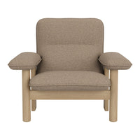 Beige upholstered armchair with smooth, minimalist design and wooden legs, featuring a simple, modern aesthetic.