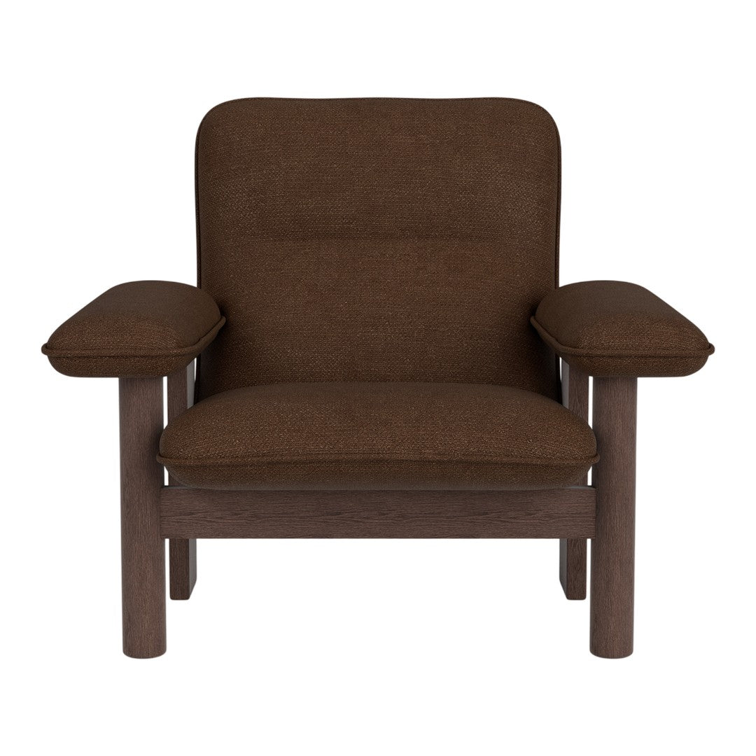 Brown upholstered armchair with a solid wood frame and smooth, minimalist design. Perfect for modern interiors.