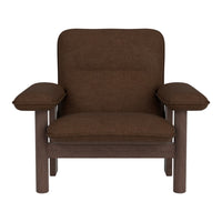 Brown upholstered armchair with a solid wood frame and smooth, minimalist design. Perfect for modern interiors.