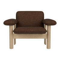 Brown upholstered armchair with light wood frame and simple, geometric design. Ideal for modern interiors.
