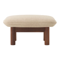 Beige cushion with a smooth texture, supported by a dark wood frame for a modern, minimalist look.