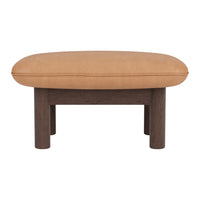 Tan oval cushion on a dark wood base, featuring a smooth, minimalistic design. Perfect for modern interiors.