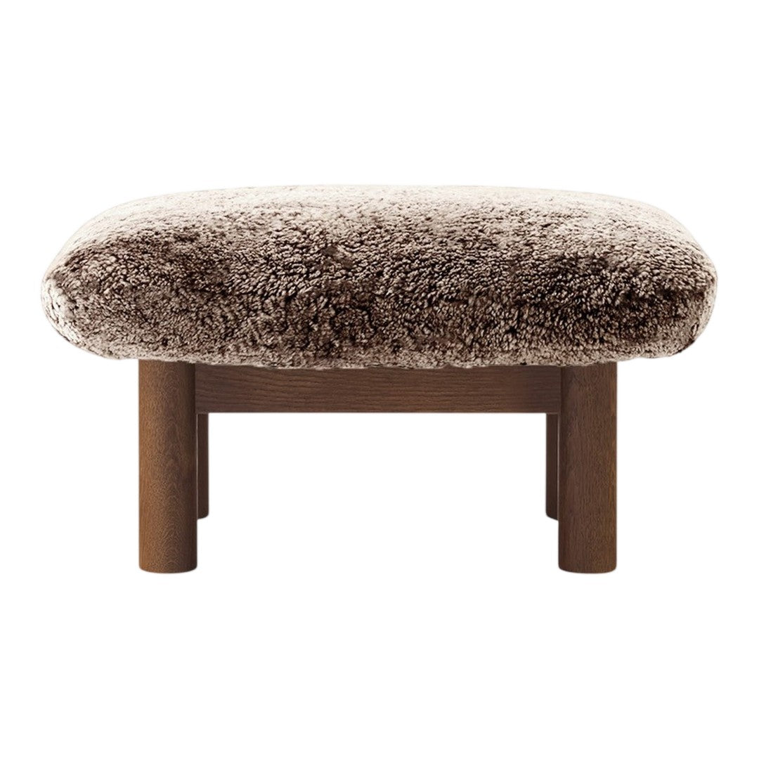 Brown fluffy ottoman with a textured soft cushion and simple wooden legs, perfect for cozy decor.