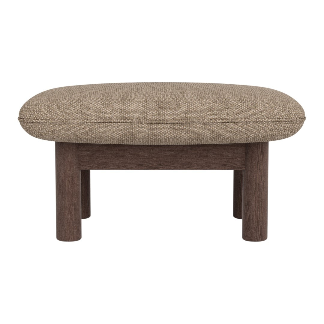 Brown oval ottoman with textured fabric and wooden legs, perfect for stylish living room decor.