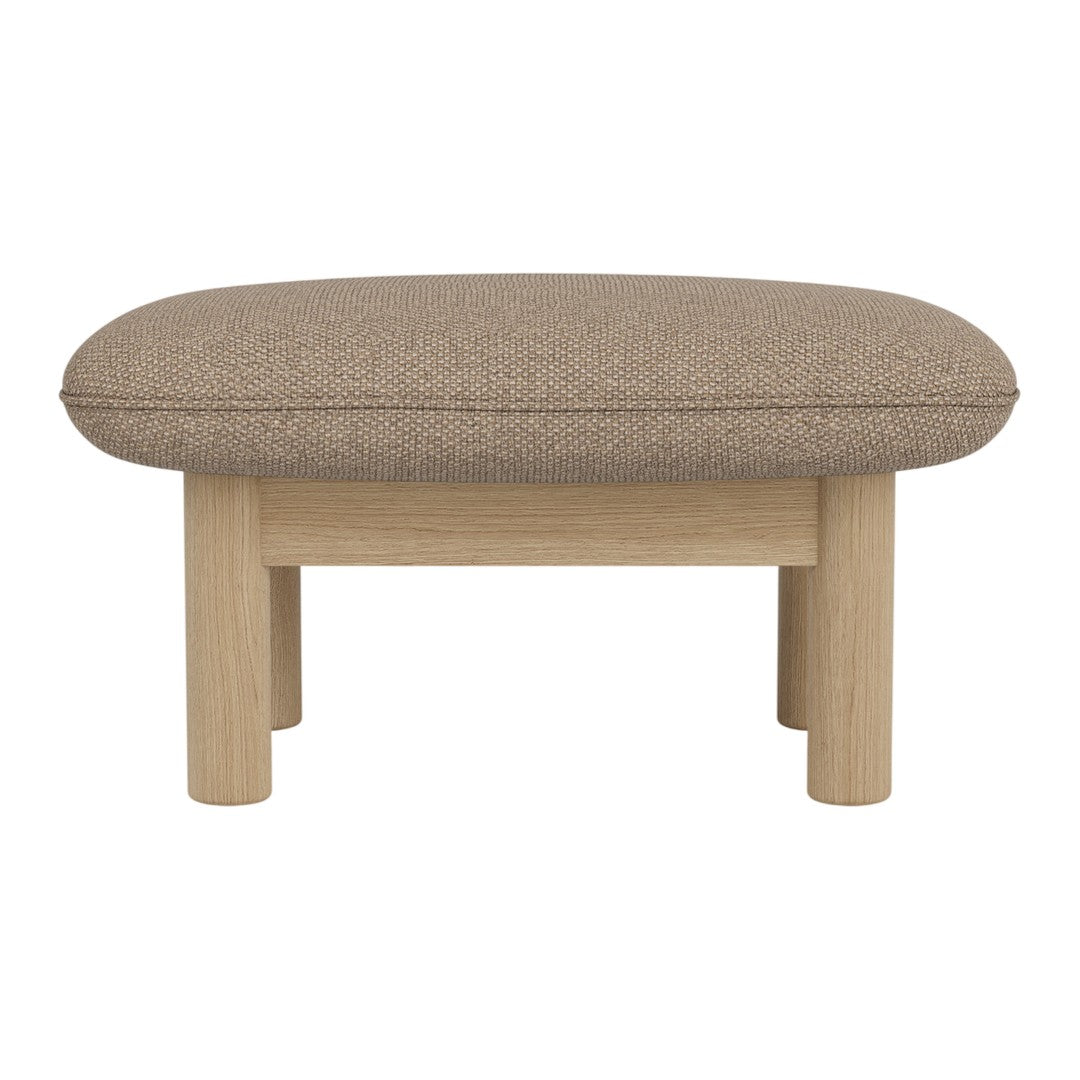 Brown upholstered ottoman with a smooth, rounded top and light wooden legs, featuring a minimalist design.