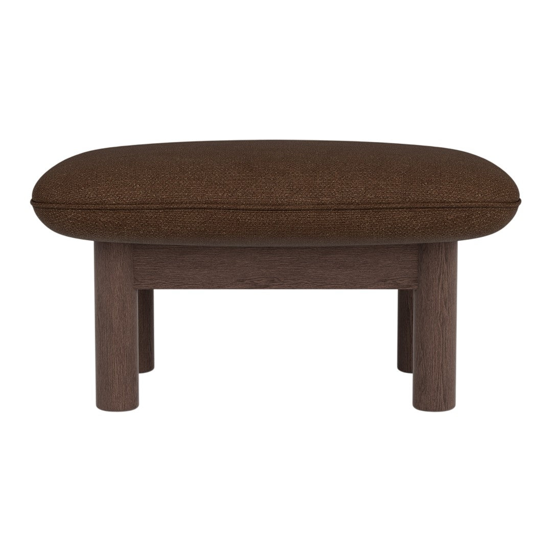 Brown upholstered ottoman with a rounded top and wooden legs, featuring a sleek, modern design.
