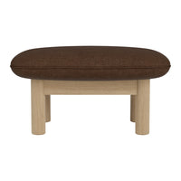 Brown upholstered ottoman with a smooth oval shape and light wooden legs. Minimalist design for versatile decor.