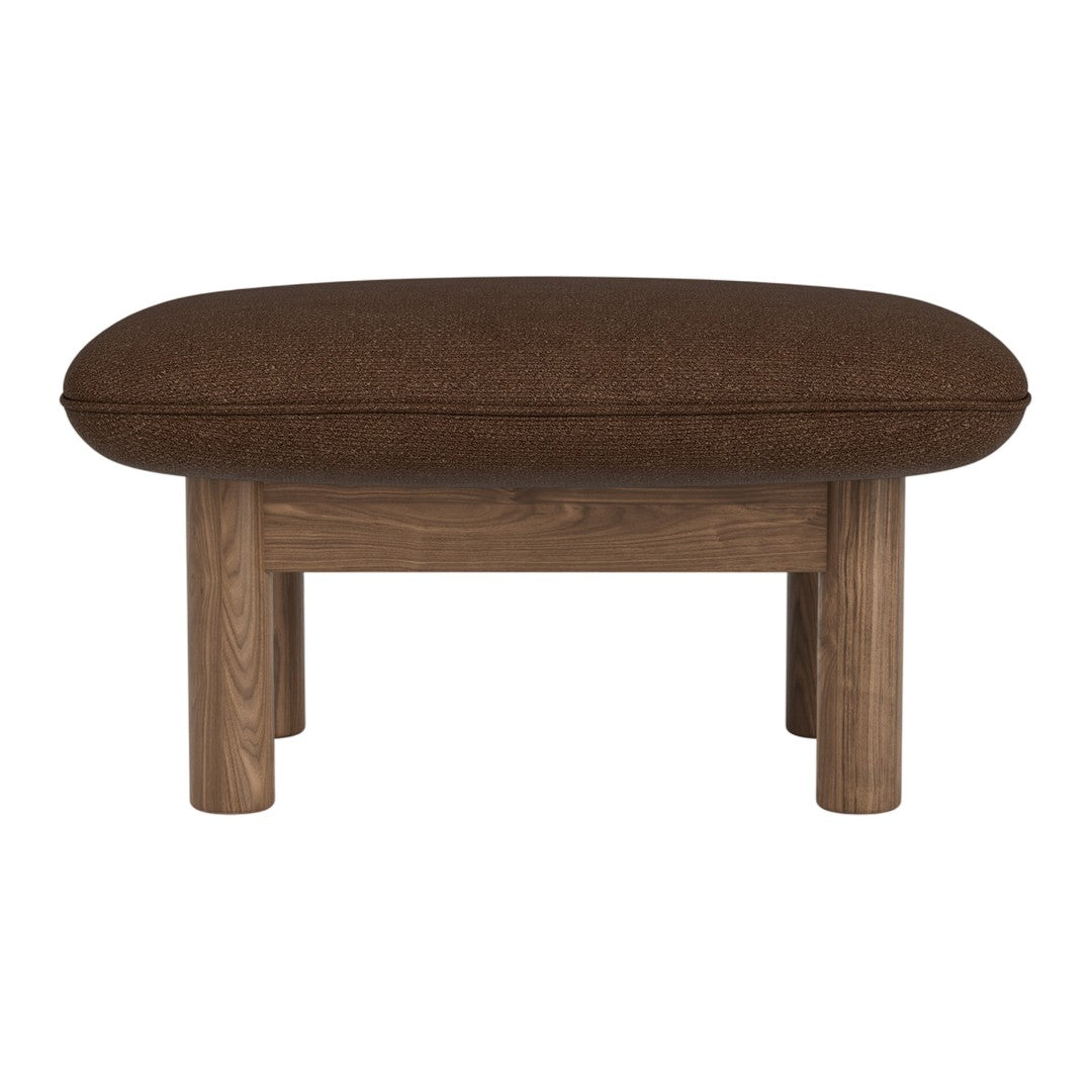 Brown upholstered ottoman with a rounded shape and wooden legs, perfect for modern decor.