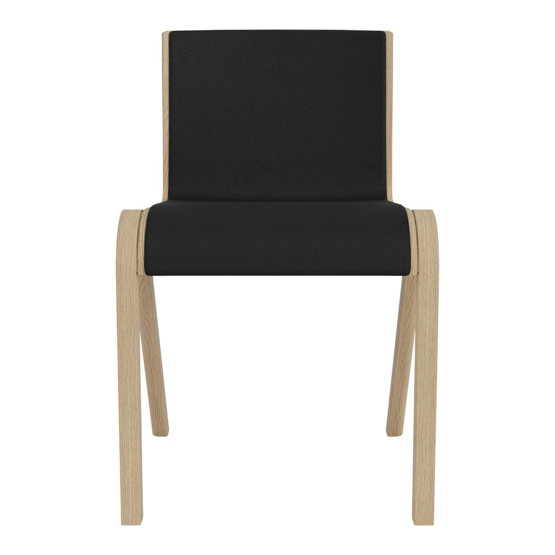 Black upholstered chair with a minimalist design and natural wood legs. Simple and modern aesthetic.