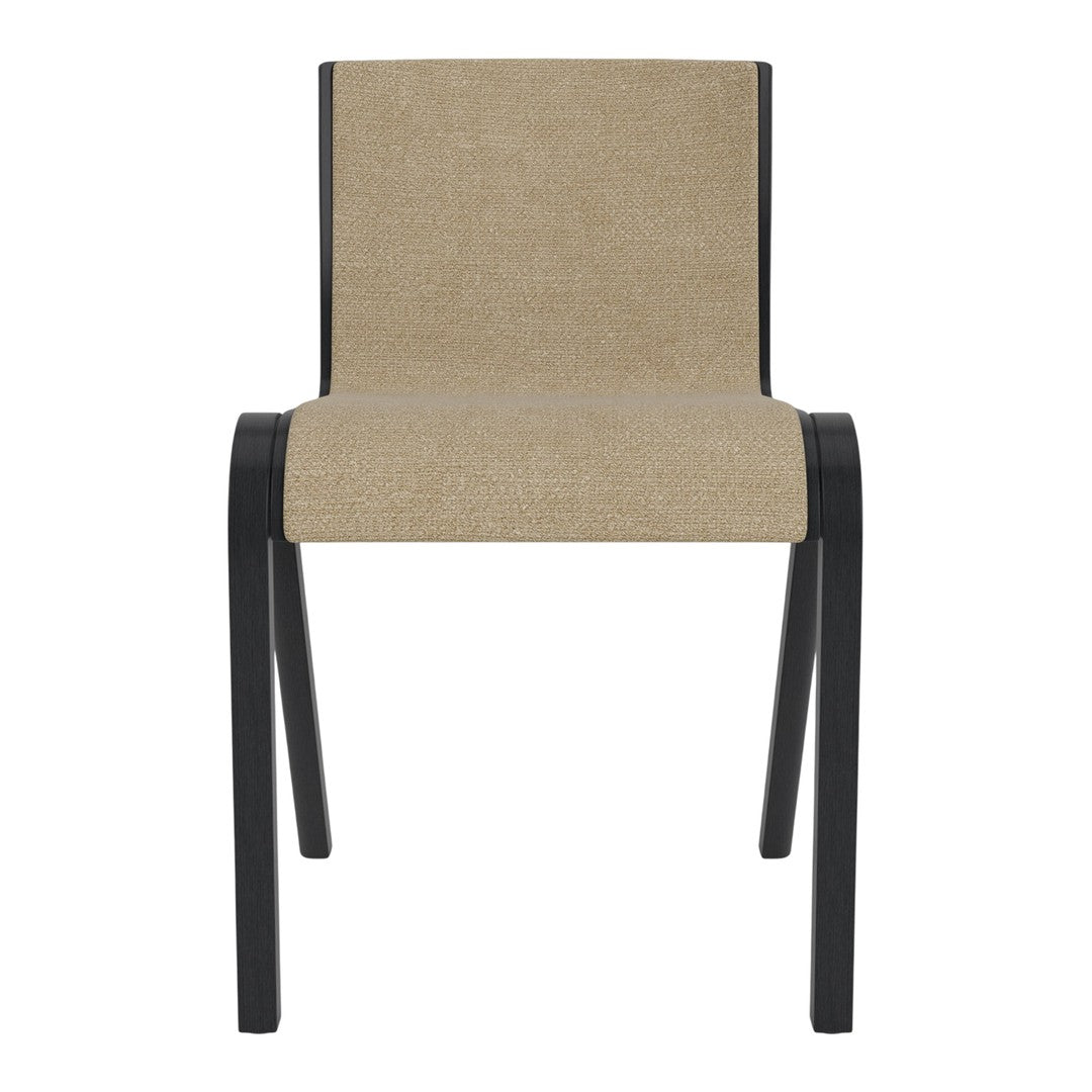 Neutral beige fabric chair with sleek black legs, perfect for modern decor. Simple, minimalist design and color.