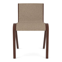 Tan upholstered chair with a textured fabric seat and dark wooden legs, featuring a minimalist design.