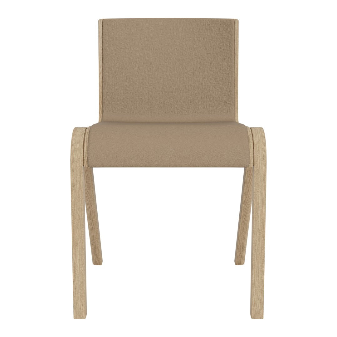Tan upholstered chair with light wood legs, featuring a simple, modern design and smooth, clean lines.