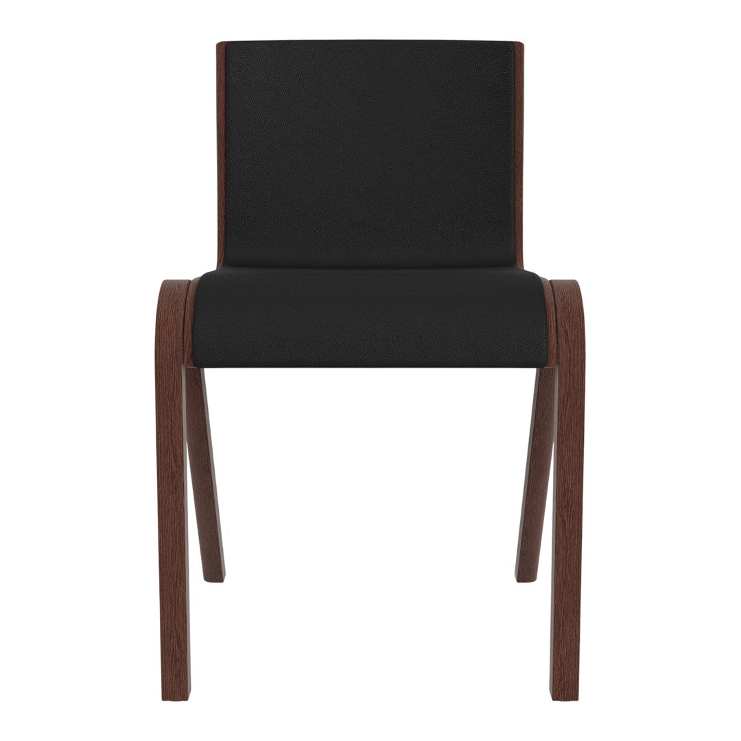Black upholstered chair with sleek wood legs, minimalist design, and modern aesthetic perfect for contemporary decor.