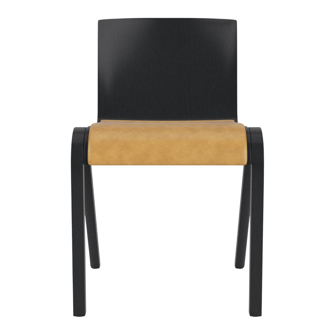 Black chair with a smooth seat in warm tan, featuring a sleek, modern design without visible patterns.