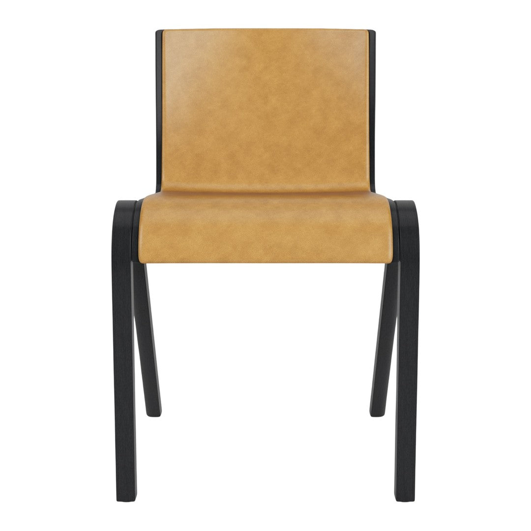Tan faux leather chair with sleek black metal frame, featuring a minimalist design and modern aesthetic.